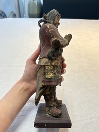A Chinese polychrome lacquered wooden sculpture of Weituo, 17/18th C.