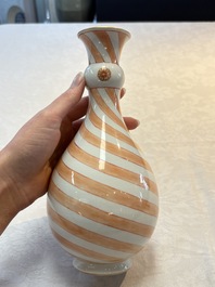 A rare pair of Chinese pear-shaped bottle vases with iron-red swirls, Kangxi