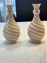 A rare pair of Chinese pear-shaped bottle vases with iron-red swirls, Kangxi