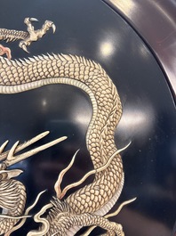 A large Japanese mother-of-pearl and bone-inlaid lacquer 'dragon' dish, Meiji, 19th C.