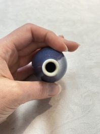A pair of Chinese blue-glazed 'Hatcher Cargo' bottle vases with incised dragons, Transitional period