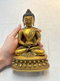 A fine Sino-Tibetan gilt-bronze figure of Buddha Shakyamuni, 17th C.