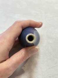 A pair of Chinese blue-glazed 'Hatcher Cargo' bottle vases with incised dragons, Transitional period