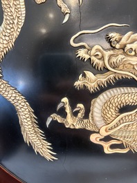 A large Japanese mother-of-pearl and bone-inlaid lacquer 'dragon' dish, Meiji, 19th C.