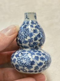 A Chinese blue and white double-gourd snuff bottle and a huali snuff bottle, Xuande and Qianlong mark, 18th C.