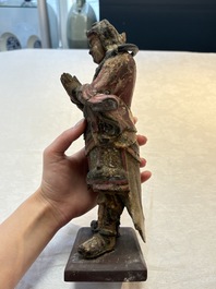A Chinese polychrome lacquered wooden sculpture of Weituo, 17/18th C.