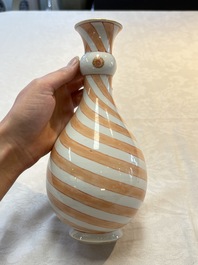 A rare pair of Chinese pear-shaped bottle vases with iron-red swirls, Kangxi