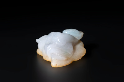 A Chinese white and yellow jade carving of a reclining lady on a leaf, Qing