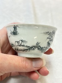 A pair of Chinese grisaille and iron-red 'landscape' cups and saucers, Yongzheng/Qianlong