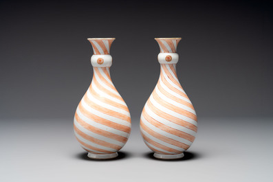 A rare pair of Chinese pear-shaped bottle vases with iron-red swirls, Kangxi