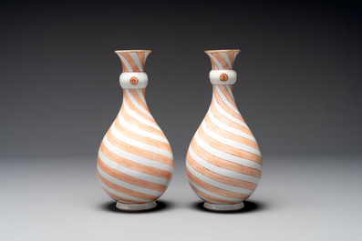 A rare pair of Chinese pear-shaped bottle vases with iron-red swirls, Kangxi