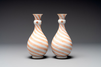A rare pair of Chinese pear-shaped bottle vases with iron-red swirls, Kangxi