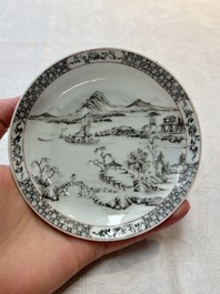 A pair of Chinese grisaille and iron-red 'landscape' cups and saucers, Yongzheng/Qianlong