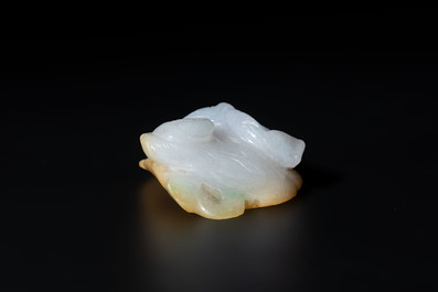 A Chinese white and yellow jade carving of a reclining lady on a leaf, Qing