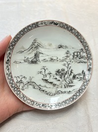 A pair of Chinese grisaille and iron-red 'landscape' cups and saucers, Yongzheng/Qianlong