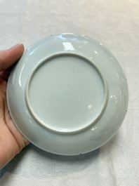 A pair of Chinese grisaille and iron-red 'landscape' cups and saucers, Yongzheng/Qianlong