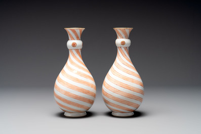 A rare pair of Chinese pear-shaped bottle vases with iron-red swirls, Kangxi