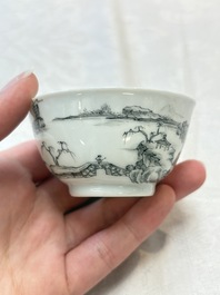 A pair of Chinese grisaille and iron-red 'landscape' cups and saucers, Yongzheng/Qianlong