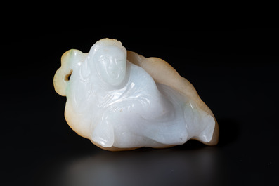 A Chinese white and yellow jade carving of a reclining lady on a leaf, Qing