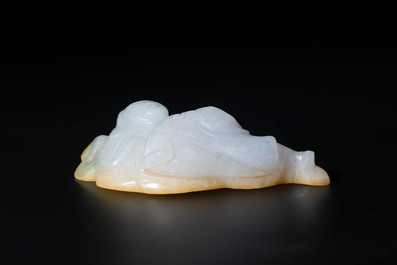A Chinese white and yellow jade carving of a reclining lady on a leaf, Qing