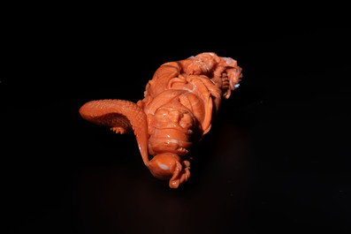 A Japanese red coral sculpture of a fisherman on wooden stand, 19/20th C.