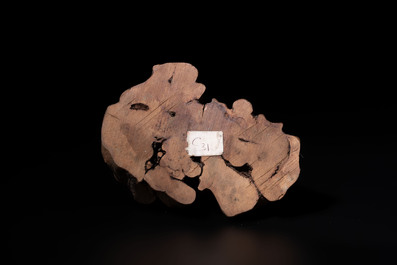 A Chinese red coral sculpture of a Milefo Buddha on wooden stand, 19/20th C.