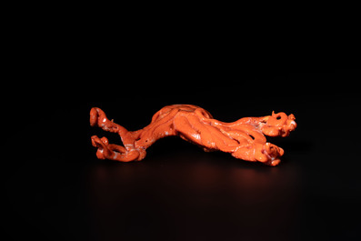 A Japanese red coral sculpture of an octopus on wooden stand, 19/20th C.