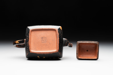 A Chinese gilt and black-lacquered Yixing teapot and cover, Qianlong mark and of the period