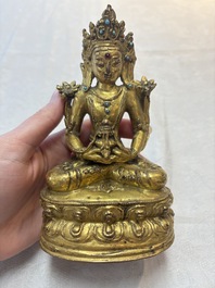 A Sino-Tibetan coral and turquoise-inlaid gilt-bronze Buddha Amitayus, 18th C.