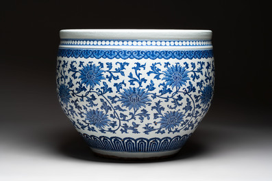A massive Chinese blue and white 'lotus scroll' fish bowl, Qianlong/Jiaqing