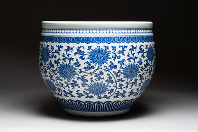 A massive Chinese blue and white 'lotus scroll' fish bowl, Qianlong/Jiaqing