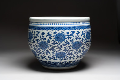 A massive Chinese blue and white 'lotus scroll' fish bowl, Qianlong/Jiaqing