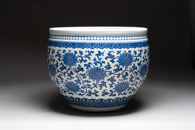 A massive Chinese blue and white 'lotus scroll' fish bowl, Qianlong/Jiaqing