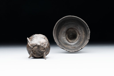A miniature pewter candlestick and grape, excavated in Rotterdam, 16/17th C. or earlier