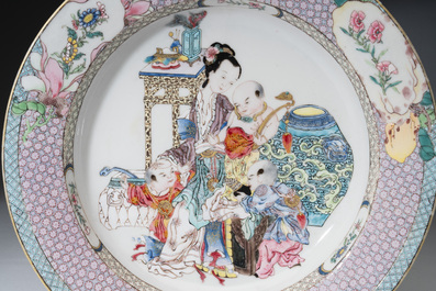 An extremely fine pair of Chinese famille rose ruby-back eggshell plates with a lady and playing boys, Yongzheng