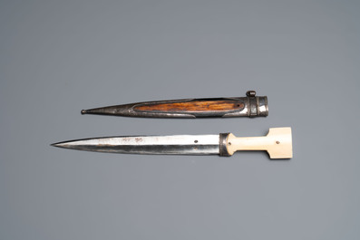 A Caucasian walrus bone-hilted kindjal with niello silver mounts, 19th C.