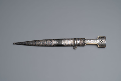 A Caucasian walrus bone-hilted kindjal with niello silver mounts, 19th C.