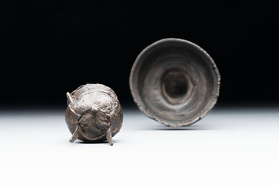 A miniature pewter candlestick and grape, excavated in Rotterdam, 16/17th C. or earlier