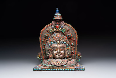 A fine large Nepalese red coral and precious stone-inset brass and silver filigree 'Bhairava' mask, 19th C.