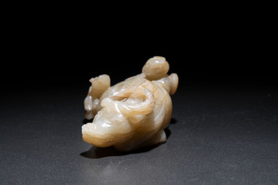 A Chinese jade 'boy on a buffalo' group, Qing