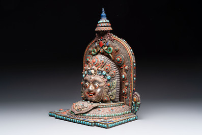 A fine large Nepalese red coral and precious stone-inset brass and silver filigree 'Bhairava' mask, 19th C.