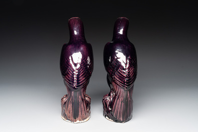 A pair of Chinese aubergine-glazed eagles, 19th C.