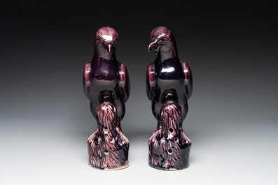 A pair of Chinese aubergine-glazed eagles, 19th C.
