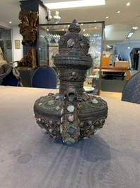 A massive Tibetan stone-inlaid copper filigree ewer and cover, 19/20th C.