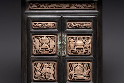 A Chinese hongmu house-form cabinet with antiquities design, 18/19th C.