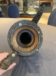 A massive Tibetan stone-inlaid copper filigree ewer and cover, 19/20th C.