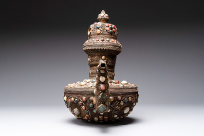 A massive Tibetan stone-inlaid copper filigree ewer and cover, 19/20th C.