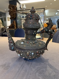 A massive Tibetan stone-inlaid copper filigree ewer and cover, 19/20th C.