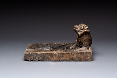 A large Chinese 'Buddhist lion' ink stone, Ming