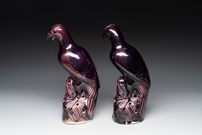 A pair of Chinese aubergine-glazed eagles, 19th C.